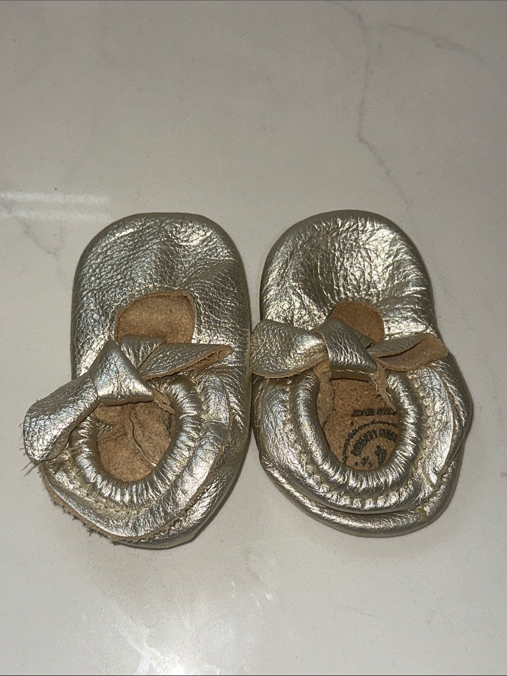 Freshly Picked Metallic Gold Bow Baby Moccasins